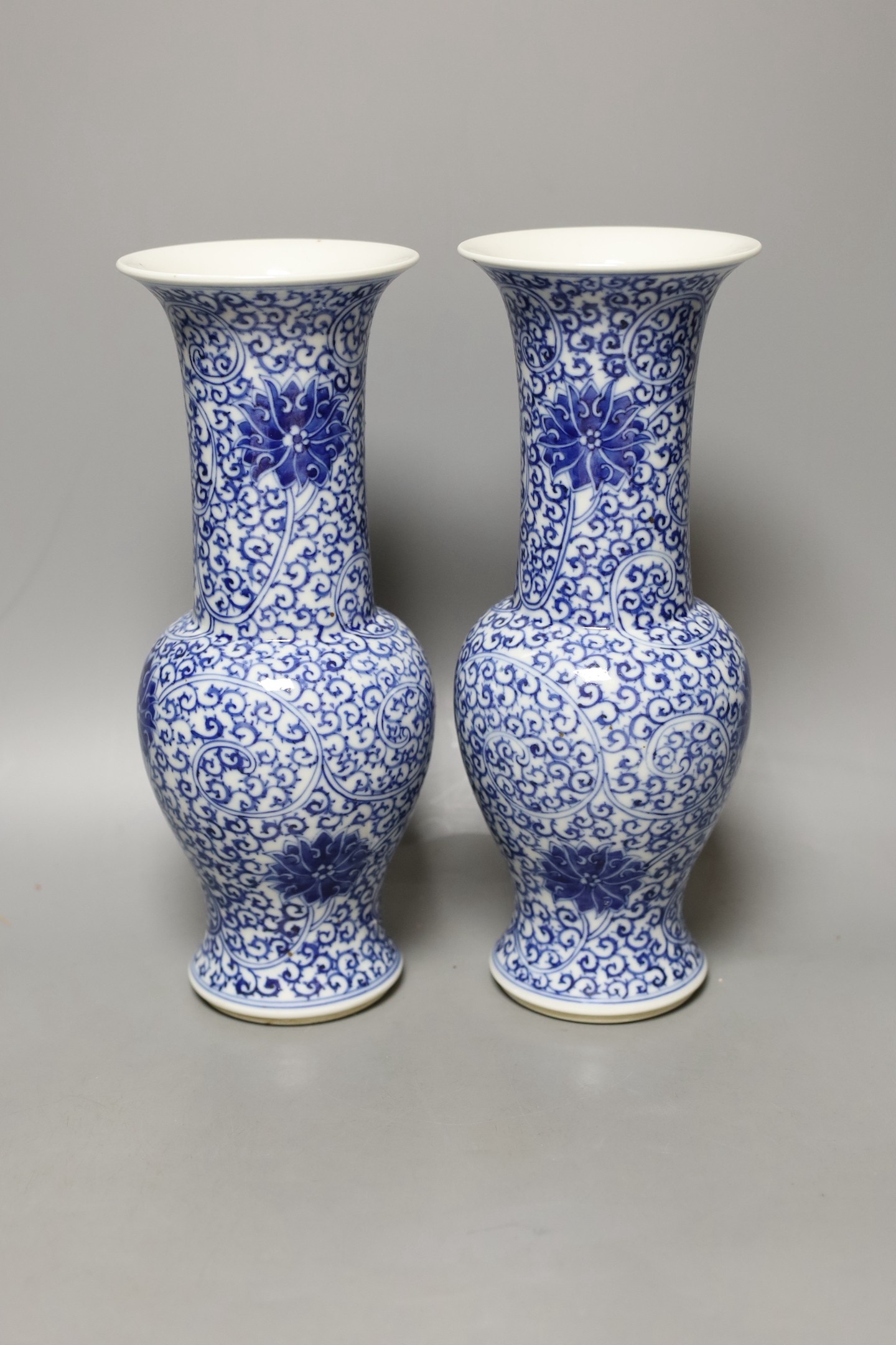 A pair of Chinese blue and white vases, 19th century, 28cm high.